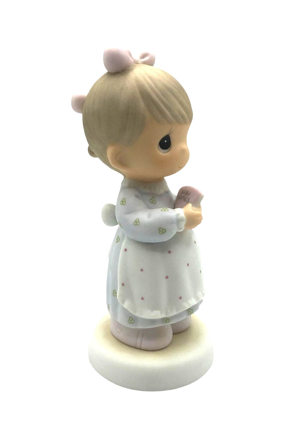 Precious Moments "The Good Lord Always Delivers" Porcelain Figurine. Features a little expectant mom perusing a book of baby names.