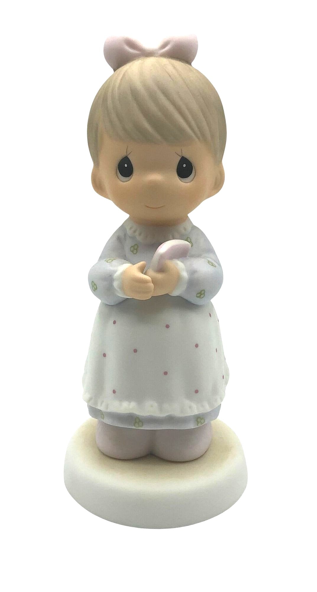 Precious Moments "The Good Lord Always Delivers" Porcelain Figurine. Features a little expectant mom perusing a book of baby names.