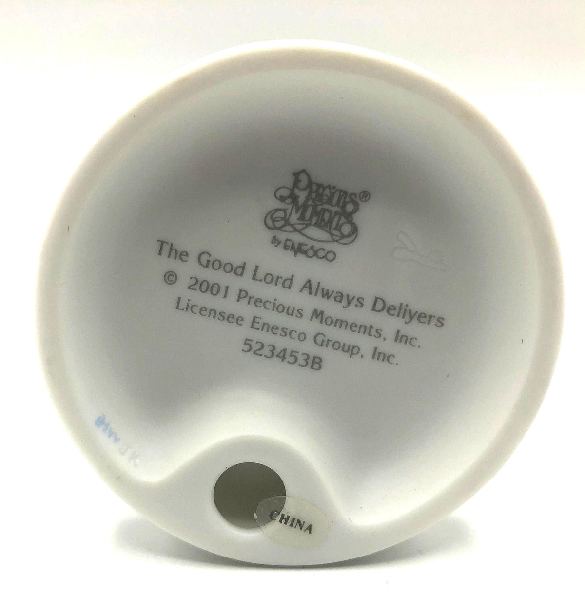 Precious Moments "The Good Lord Always Delivers" Porcelain Figurine. Features a little expectant mom perusing a book of baby names.