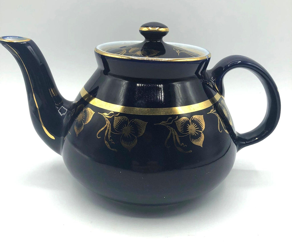 Vintage Hall's Cobalt Blue Teapot with Gold Flower Pattern and Gold Trim.  8.5" Spout to Handle and 5.5" high with lid.  6 Cup Capacity.