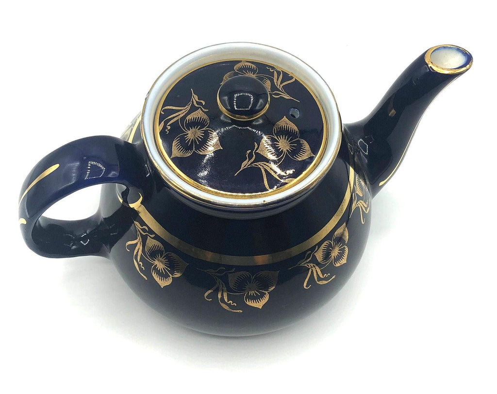 Vintage Hall's Cobalt Blue Teapot with Gold Flower Pattern and Gold Trim.  8.5" Spout to Handle and 5.5" high with lid.  6 Cup Capacity.