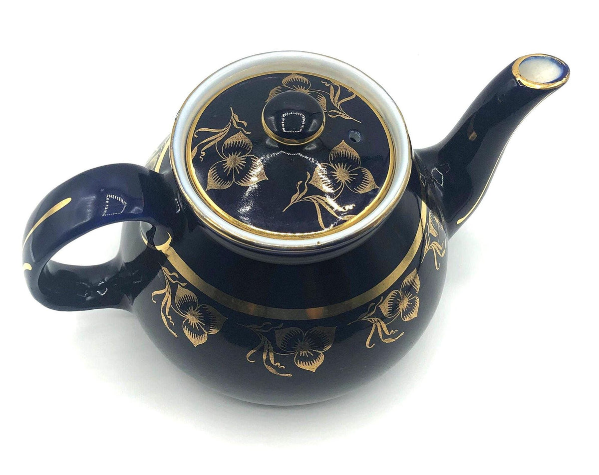 Vintage Hall's Cobalt Blue Teapot with Gold Flower Pattern and Gold Trim.  8.5" Spout to Handle and 5.5" high with lid.  6 Cup Capacity.