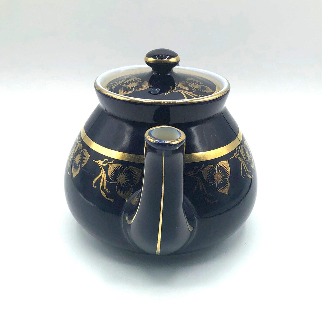 Vintage Hall's Cobalt Blue Teapot with Gold Flower Pattern and Gold Trim.  8.5" Spout to Handle and 5.5" high with lid.  6 Cup Capacity.