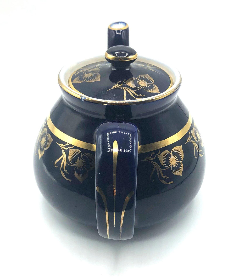 Vintage Hall's Cobalt Blue Teapot with Gold Flower Pattern and Gold Trim.  8.5" Spout to Handle and 5.5" high with lid.  6 Cup Capacity.