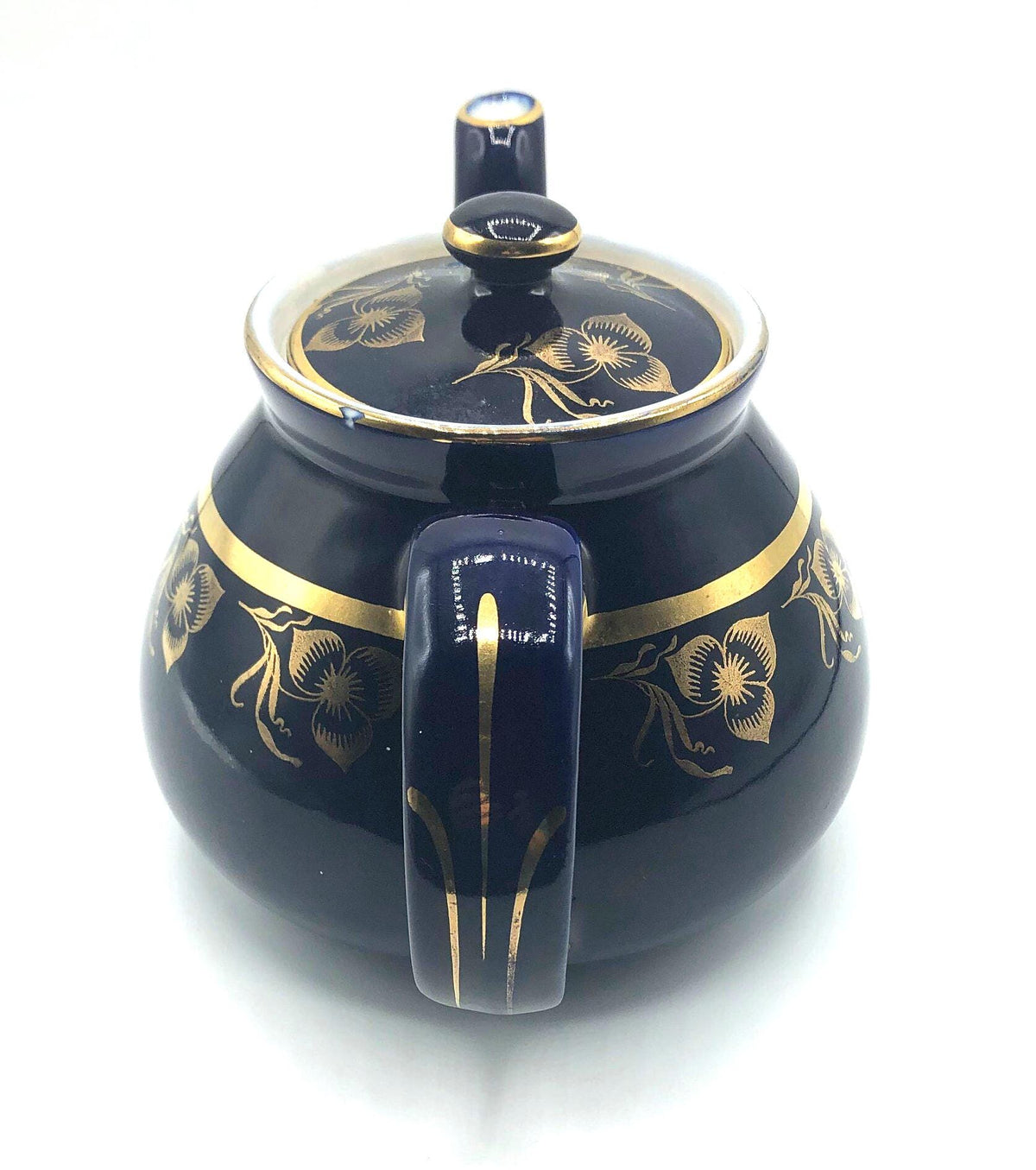 Vintage Hall's Cobalt Blue Teapot with Gold Flower Pattern and Gold Trim.  8.5" Spout to Handle and 5.5" high with lid.  6 Cup Capacity.