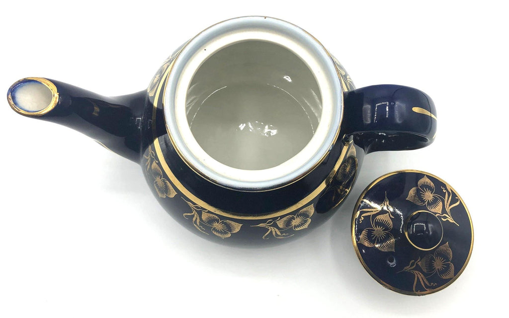 Vintage Hall's Cobalt Blue Teapot with Gold Flower Pattern and Gold Trim.  8.5" Spout to Handle and 5.5" high with lid.  6 Cup Capacity.