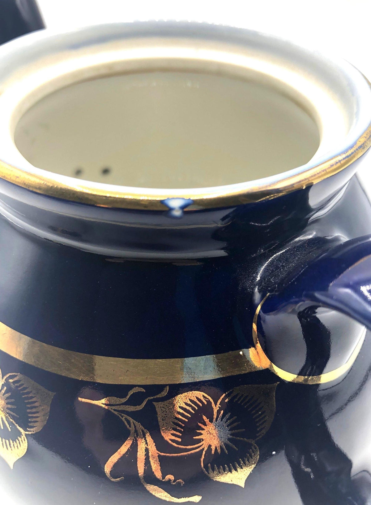 Vintage Hall's Cobalt Blue Teapot with Gold Flower Pattern and Gold Trim.  8.5" Spout to Handle and 5.5" high with lid.  6 Cup Capacity.