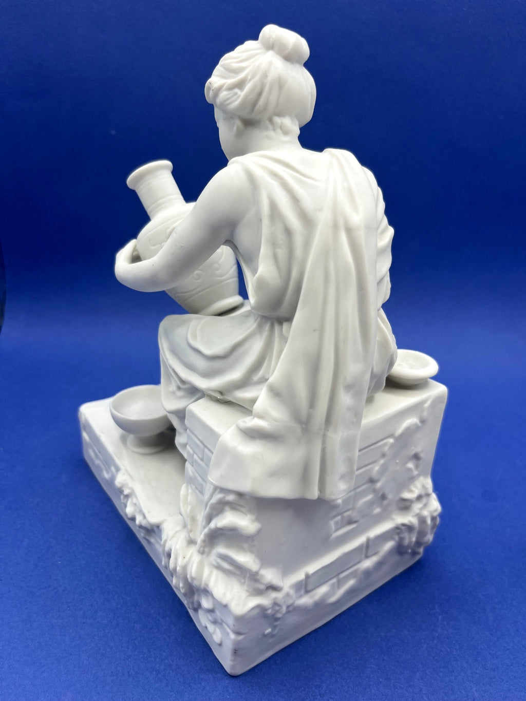 Vintage Neoclassical Greek Roman White Bisque Porcelain Figurines Depicting Male and Female Potters Shaping and Detailing Vases. 8" tall