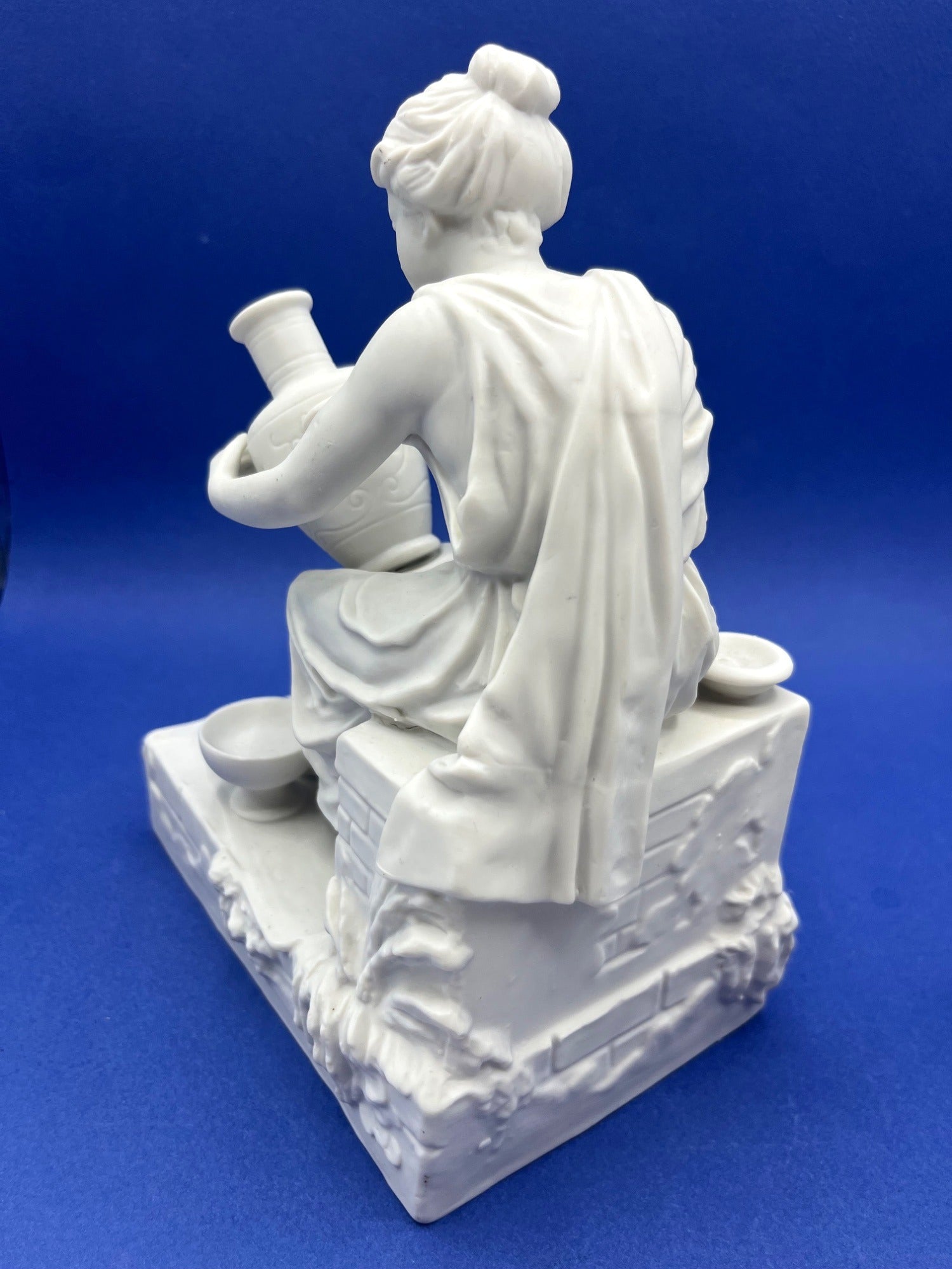 Vintage Neoclassical Greek Roman White Bisque Porcelain Figurines Depicting Male and Female Potters Shaping and Detailing Vases. 8" tall