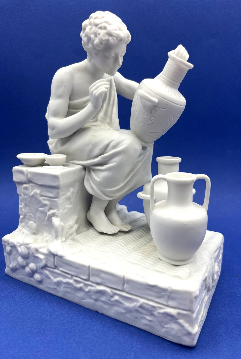 Vintage Neoclassical Greek Roman White Bisque Porcelain Figurines Depicting Male and Female Potters Shaping and Detailing Vases. 8" tall