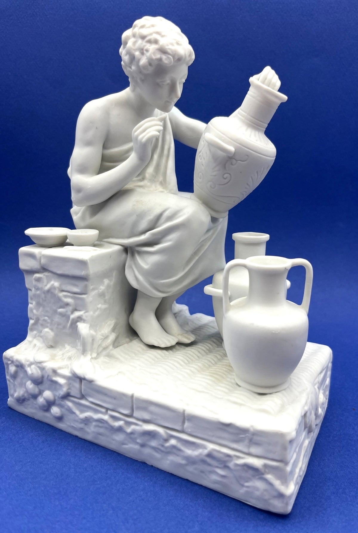 Vintage Neoclassical Greek Roman White Bisque Porcelain Figurines Depicting Male and Female Potters Shaping and Detailing Vases. 8" tall