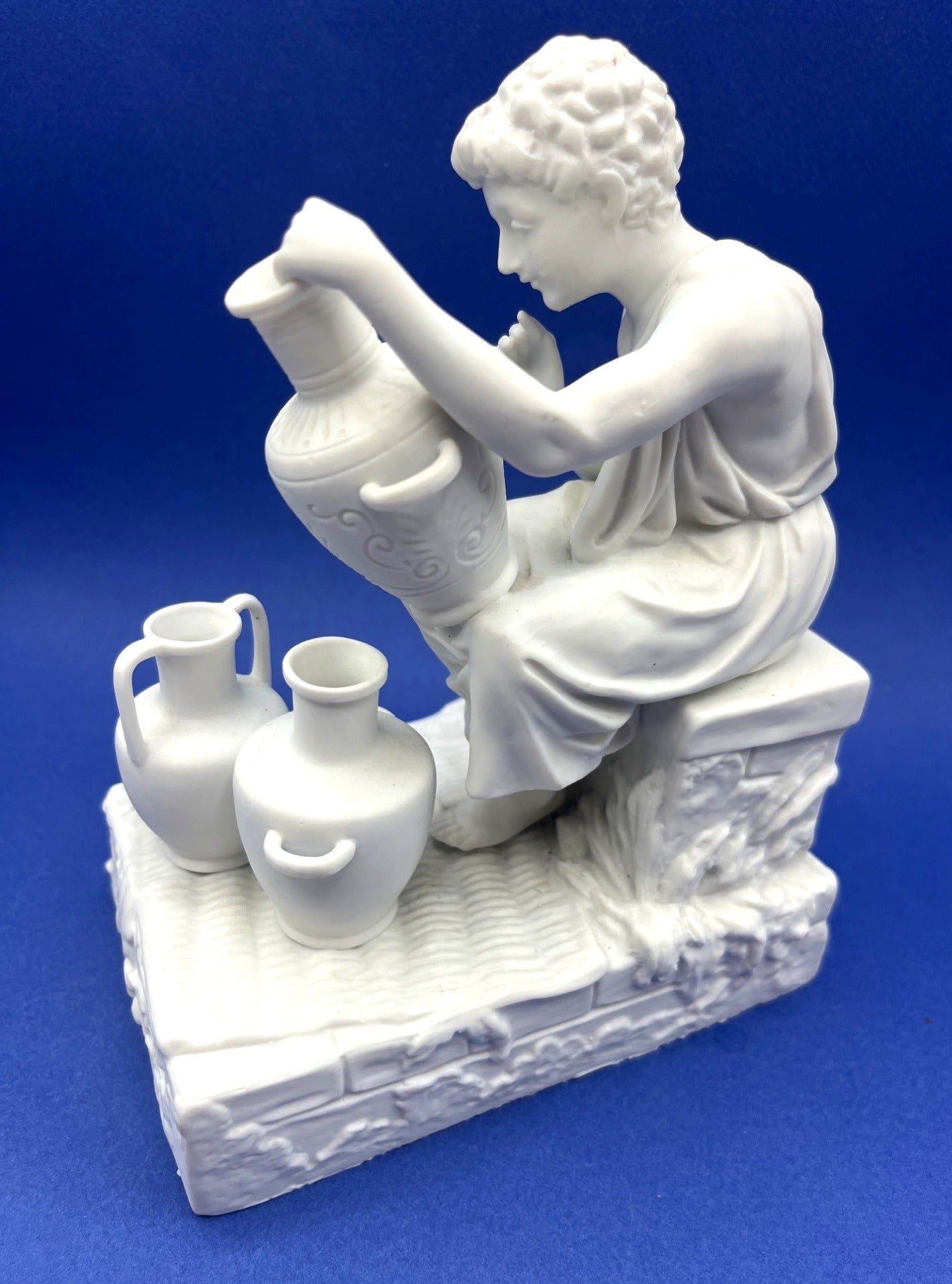 Vintage Neoclassical Greek Roman White Bisque Porcelain Figurines Depicting Male and Female Potters Shaping and Detailing Vases. 8" tall
