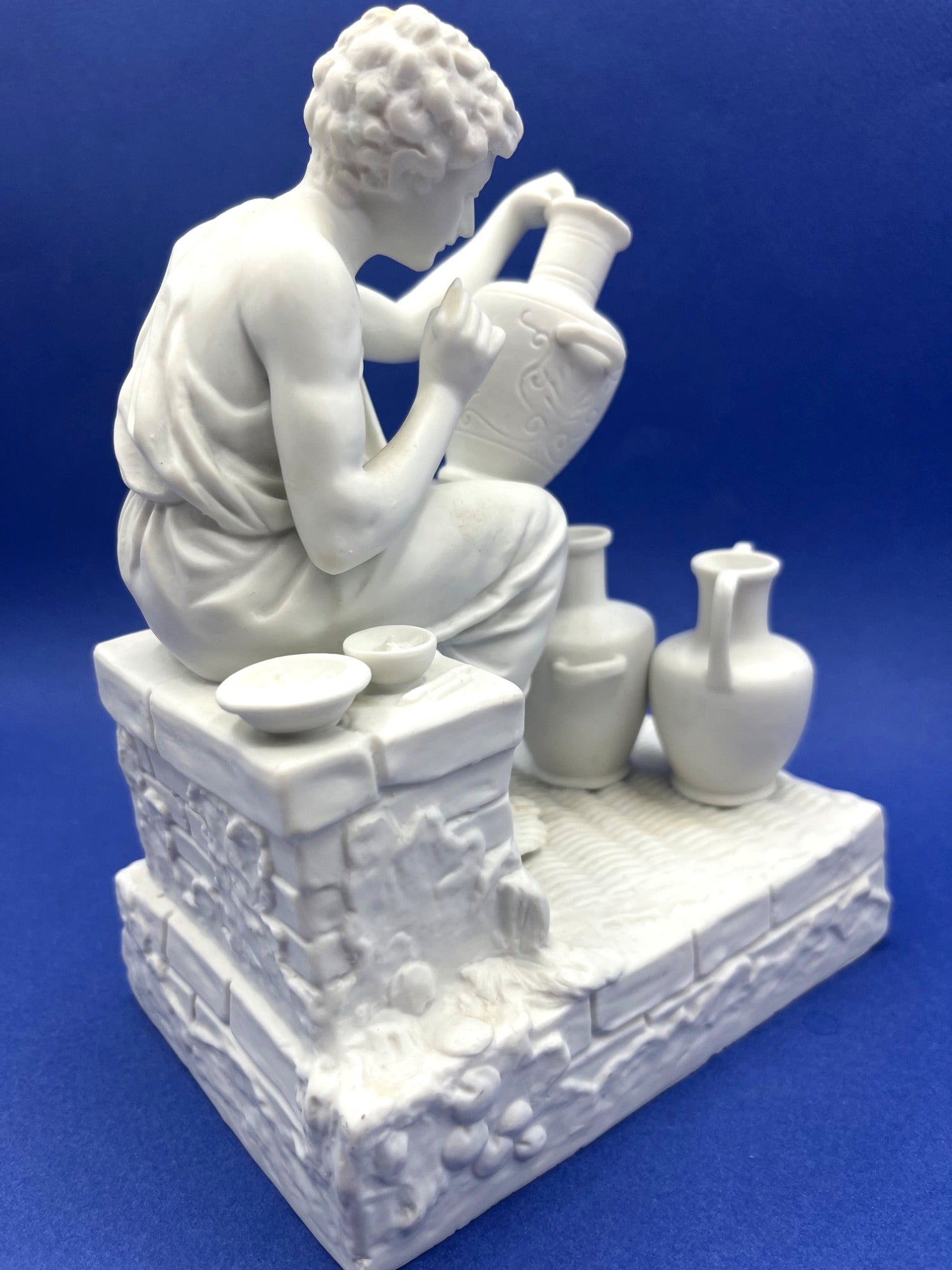 Vintage Neoclassical Greek Roman White Bisque Porcelain Figurines Depicting Male and Female Potters Shaping and Detailing Vases. 8" tall