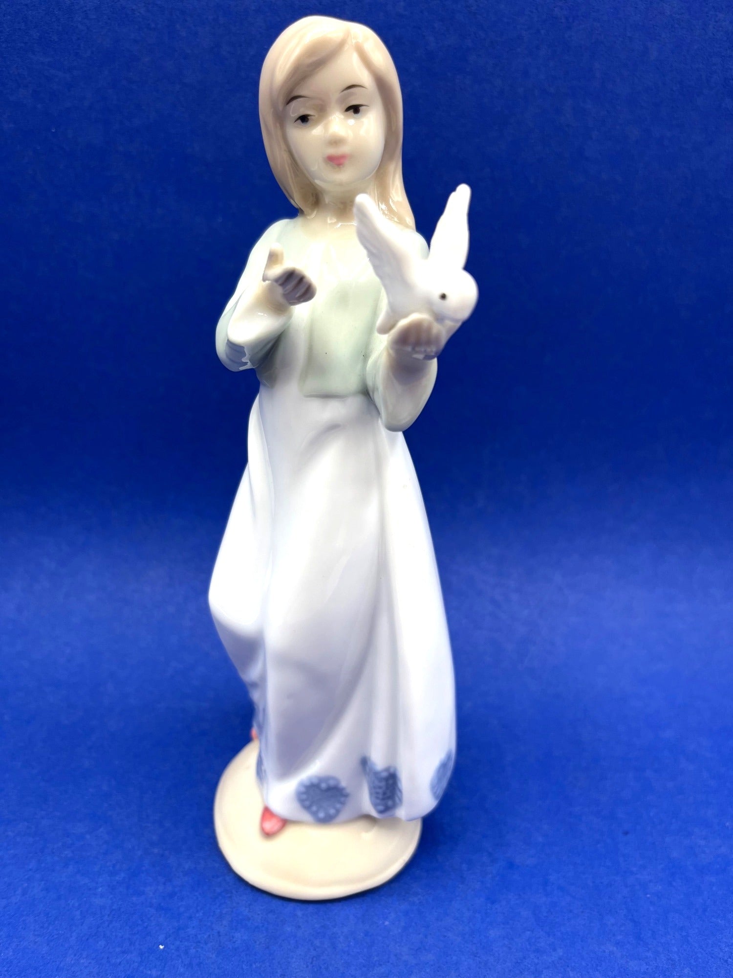 Porcelain Girl Figurine With Dove Blue & White Dress 8 Inches Tall