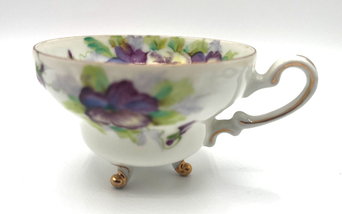 Vintage Hand Painted Footed Teacup & Saucer Set With Purple & Green Pansies Floral Design Made In Occupied Japan