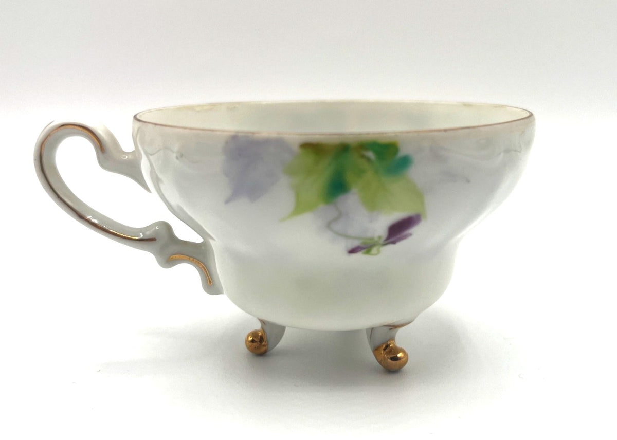 Vintage Hand Painted Footed Teacup & Saucer Set With Purple & Green Pansies Floral Design Made In Occupied Japan