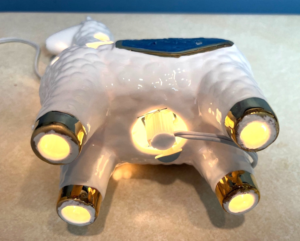 Ceramic Llama-Shaped Electric Accent Night Light With Gold Accents & Blue Saddle Design Illuminated Cutouts 9.5" tall