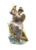 Grandeur Noel Angel at the Sea on a Large Sea Shell, made in China by O'Well. 12.5" tall
