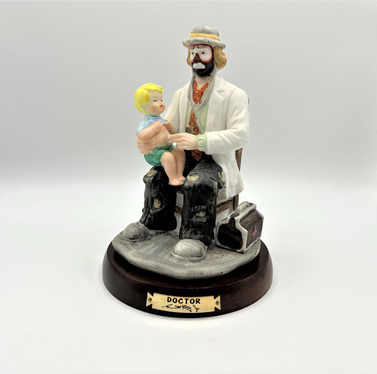 Vintage Emmett Kelly Jr. Doctor Porcelain Figurine The Doctor with Solid Wood Base by Flambro. 5.25" wide x 8" tall