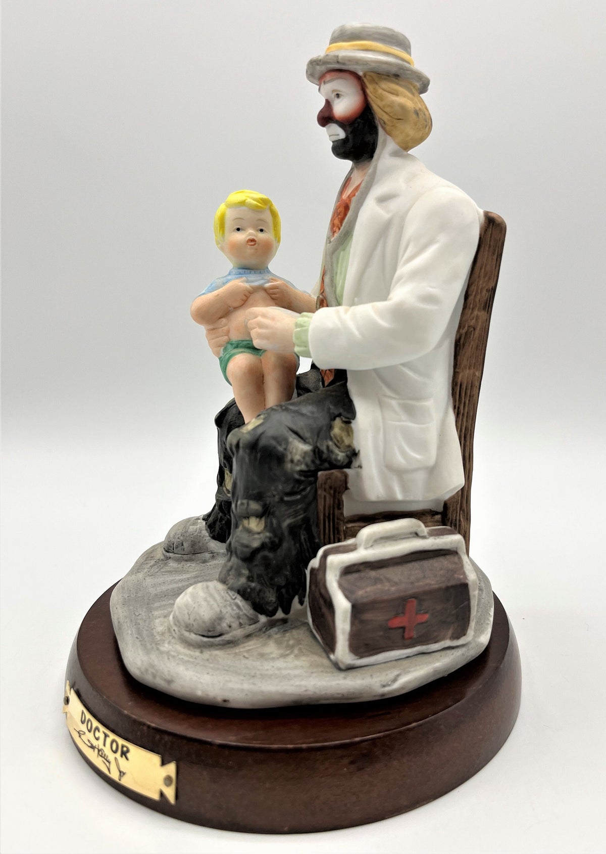 Vintage Emmett Kelly Jr. Doctor Porcelain Figurine The Doctor with Solid Wood Base by Flambro. 5.25" wide x 8" tall