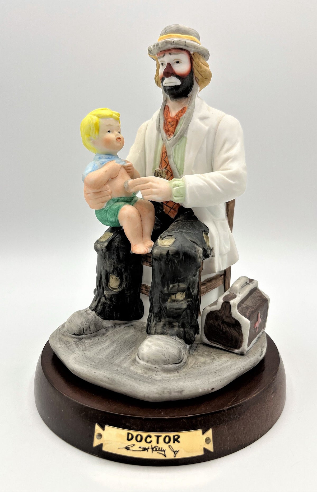 Vintage Emmett Kelly Jr. Doctor Porcelain Figurine The Doctor with Solid Wood Base by Flambro. 5.25" wide x 8" tall