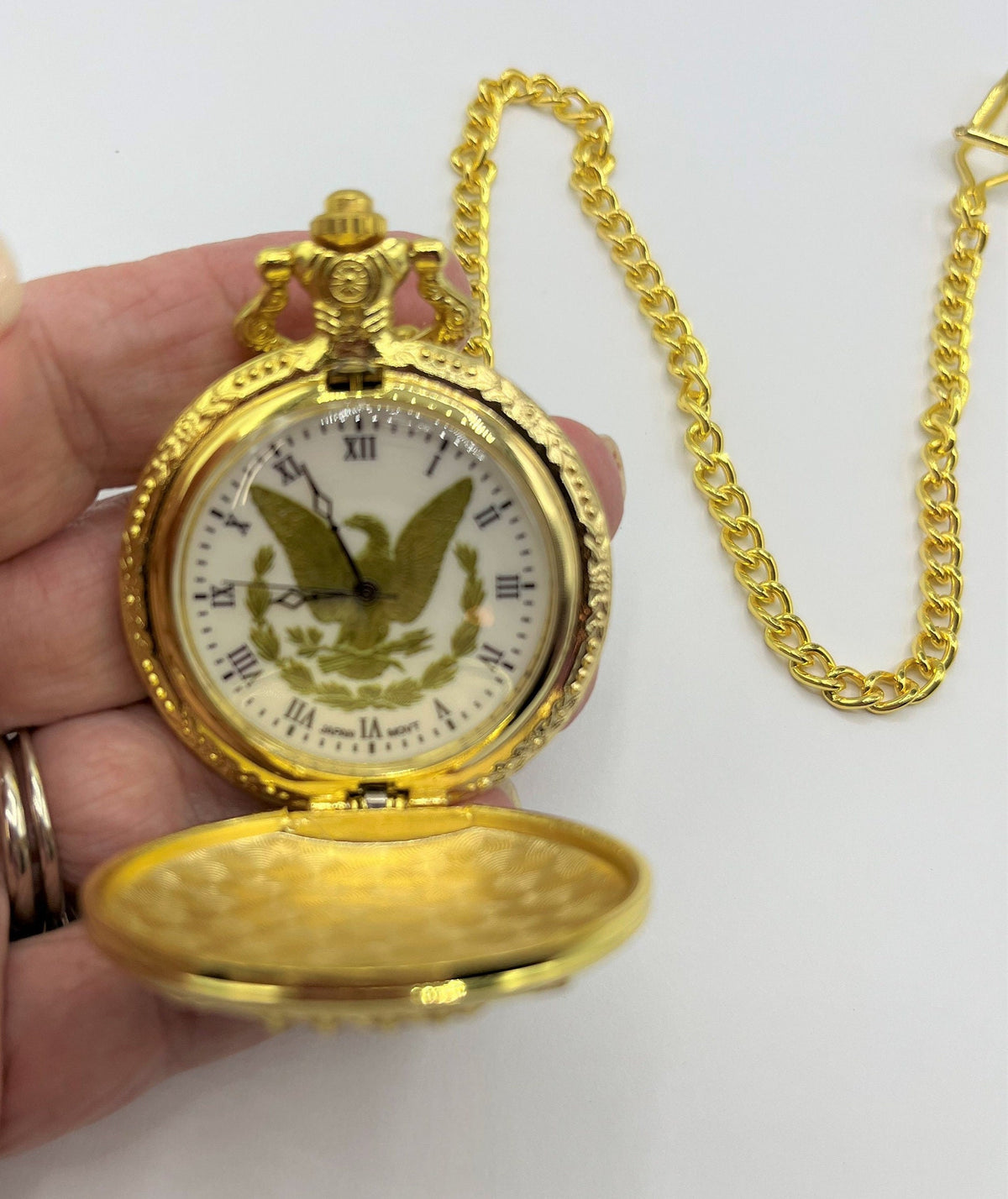 Liberty Eagle Gold Tone Pocket Watch with Chain, Dimensional Liberty Eagle on the front. New Battery Installed.  1.75" diameter