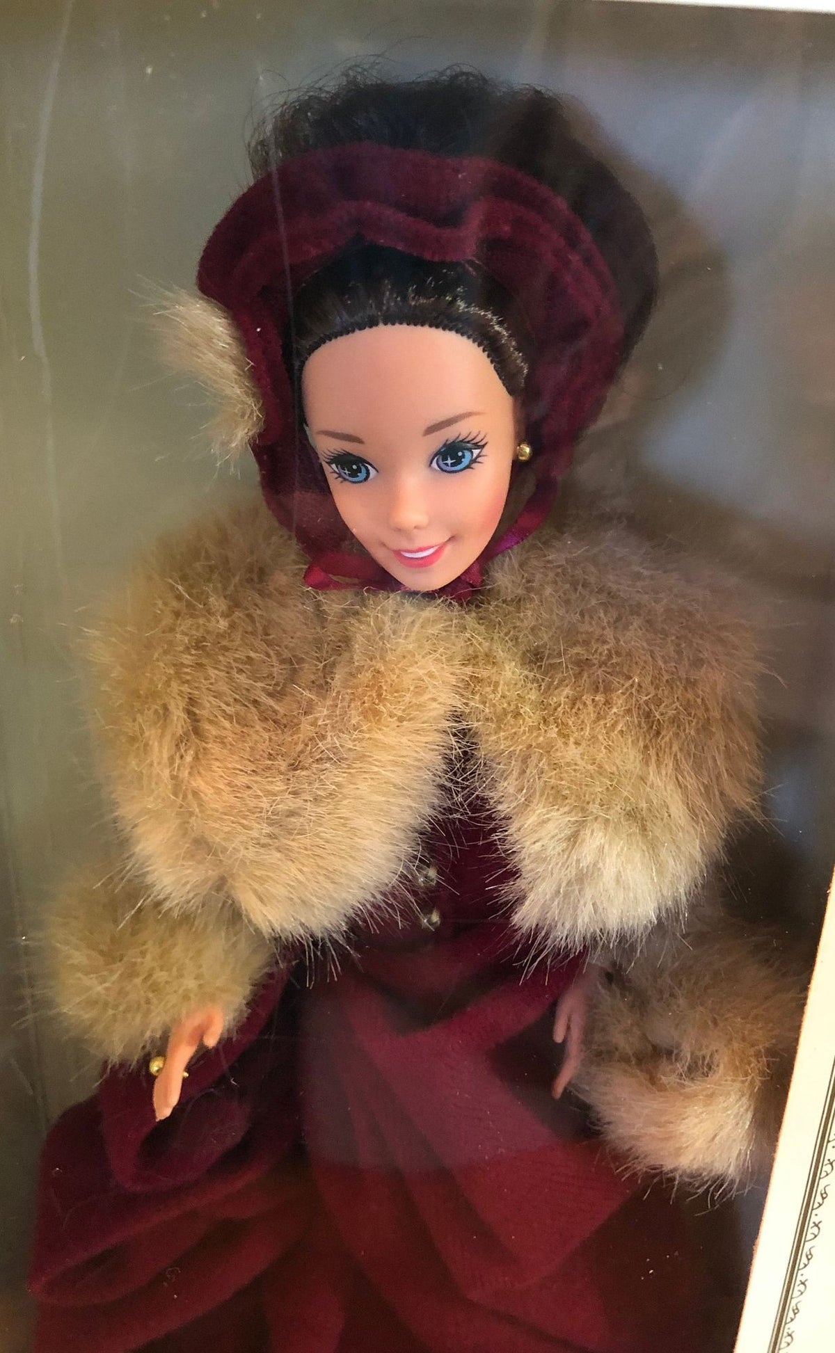 1994 Victorian Elegance Barbie Special Edition for Hallmark. Dressed in a Burgundy Skating Costume with Hat and Muff and Ice Skates. 11"