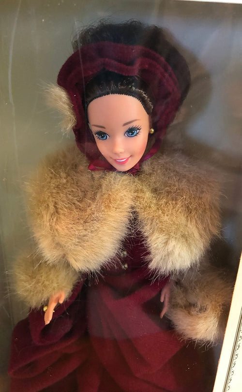 1994 Victorian Elegance Barbie Special Edition for Hallmark. Dressed in a Burgundy Skating Costume with Hat and Muff and Ice Skates. 11"